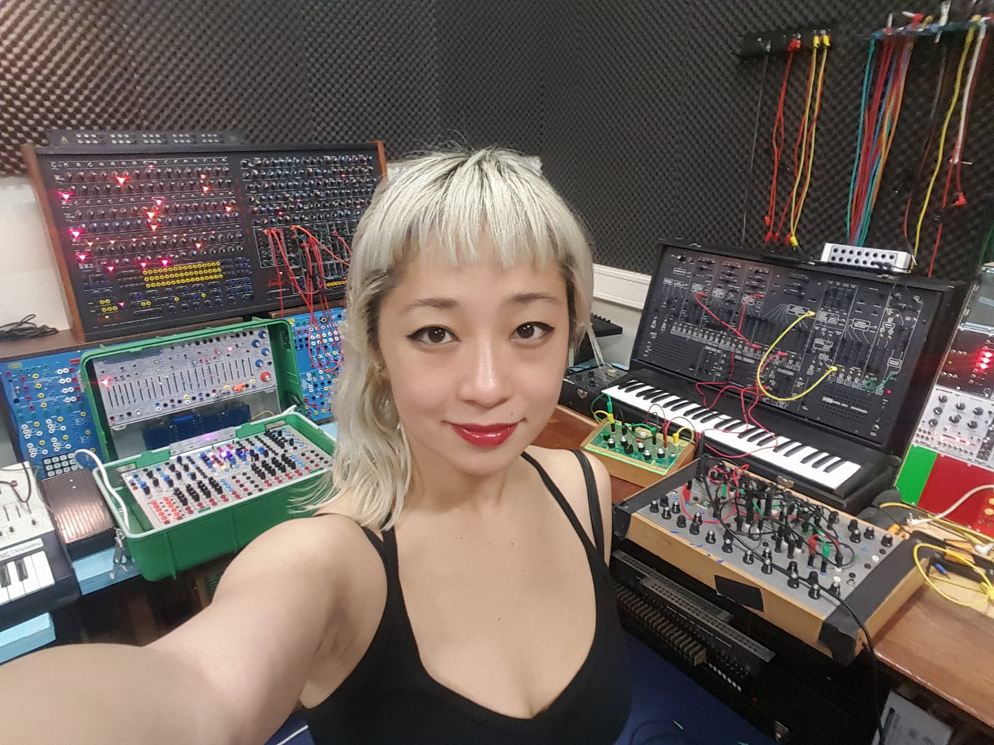 Victoria Shen surrounded by synthesizers at the WORM Studio in Rotterdam.