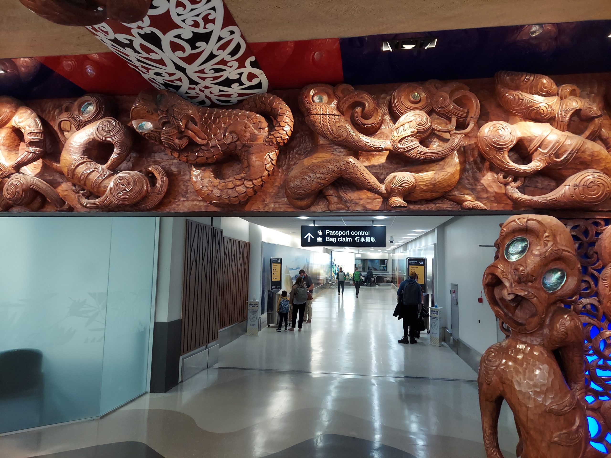 Maori sculptures surround one of the walls in the international arrival terminal of the Auckland Airport.
