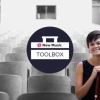 Cayla Bellamy sitting in an empty classroom with an overlay of the NMBx ToolBox banner