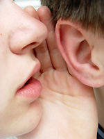 whispering into ear